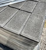 A close up look at the grey pavers to be installed in the patio